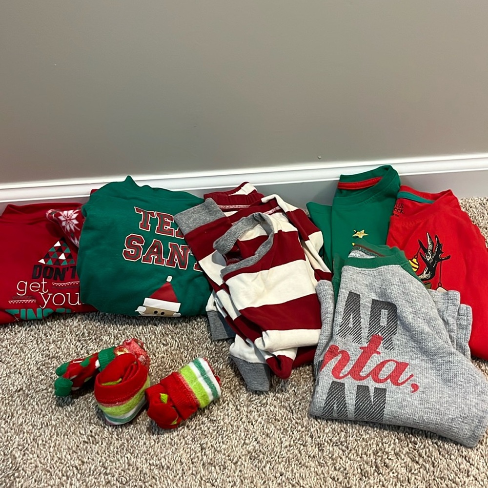Christmas Santa lot of size 4T/5 mix pajamas, long sleeve shirts and socks.